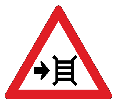 Motor gate ahead with cattle grid. Pass on the side of the cattle grid