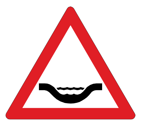 Water crosses the road at a drift ahead. Go very slowly and test the brakes afterwards