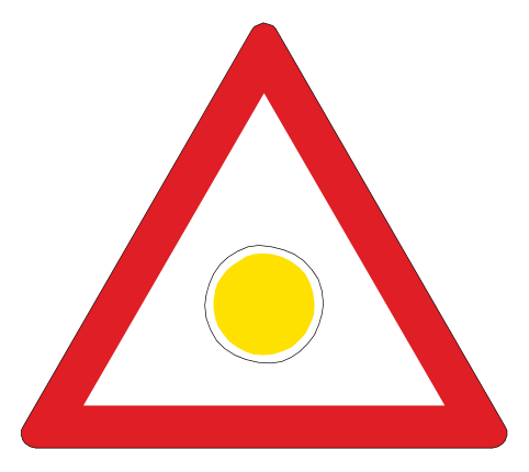 Hazard ahead. Slow down and approach with caution