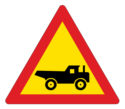 Construction vehicles entering or crossing the road ahead